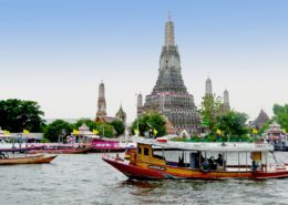 Take a boat tour on the with Wat Arun in the background