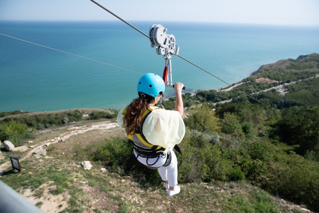 Zip lining is a thrilling activity to take on while traveling