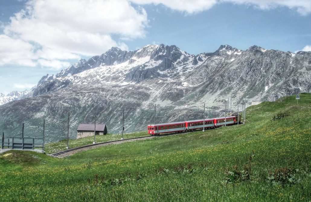 The Glacier Express crosses the Swiss Alps in the East-West direction. Here it is descending the Oberalp Pass high above Andermatt.
